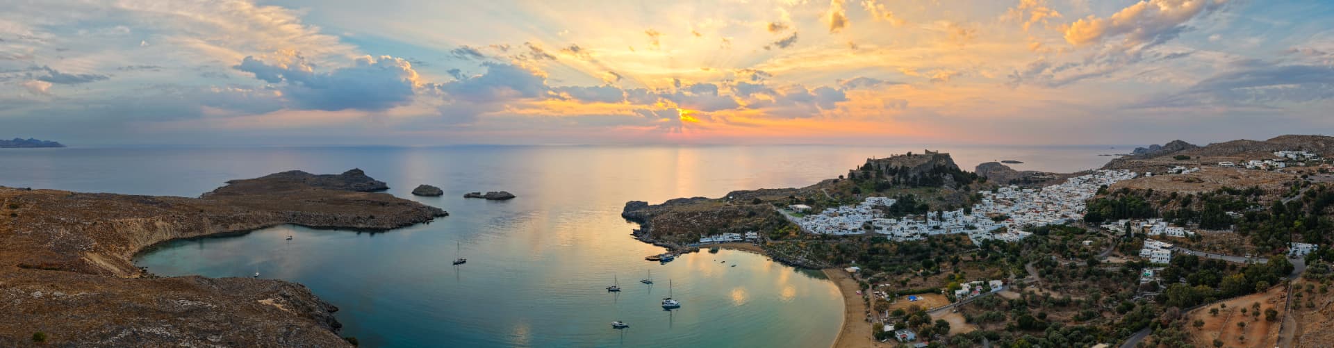 Lindos bay and Acropolis at sunset