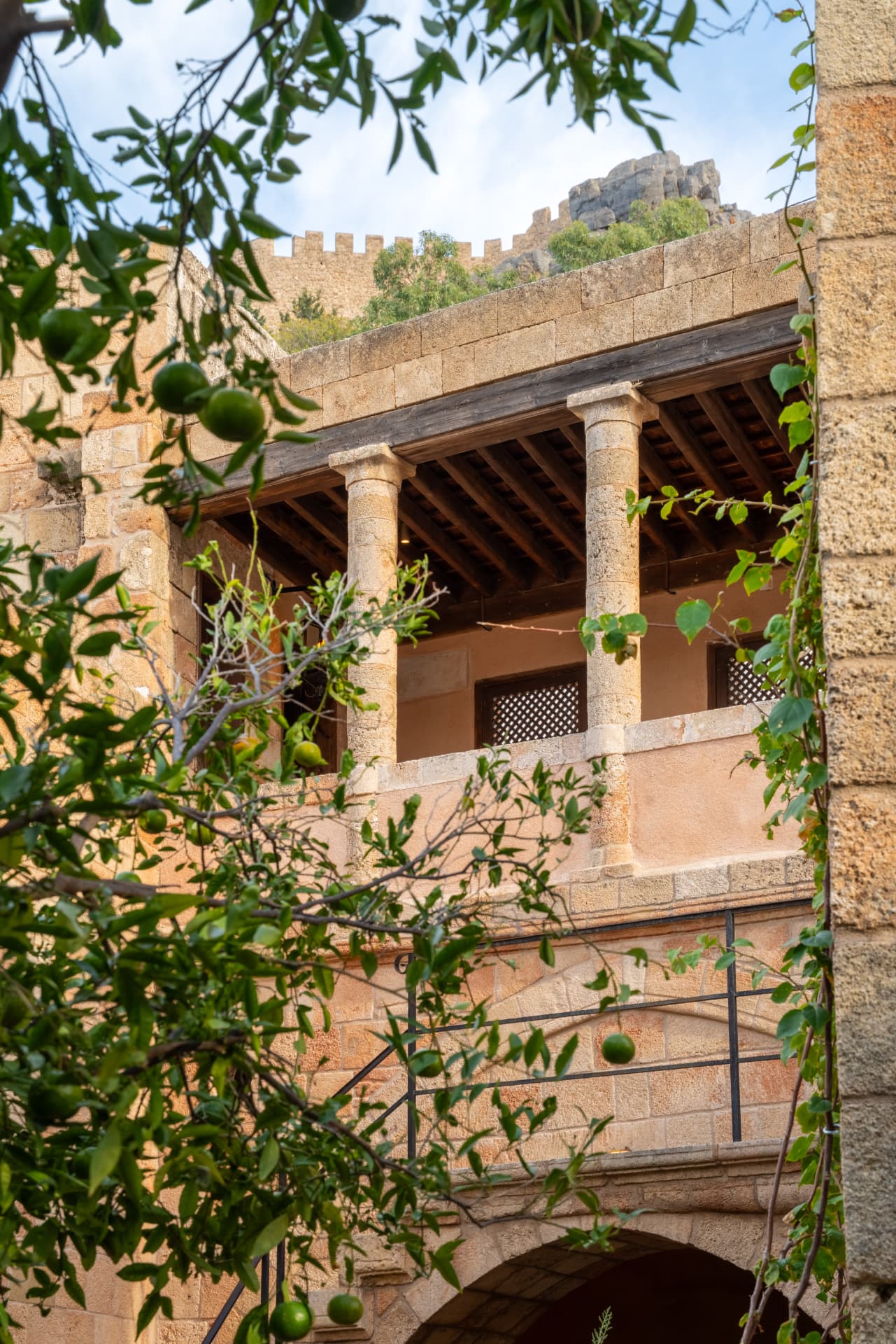 Sunlit courtyard terrace at Vasilikos Mansion